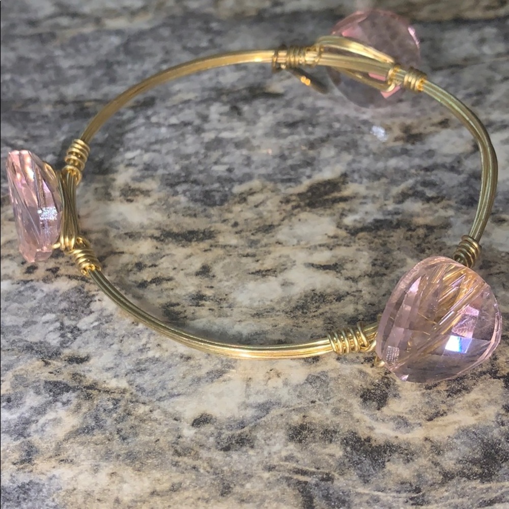 Small gold bracelet with pink stones